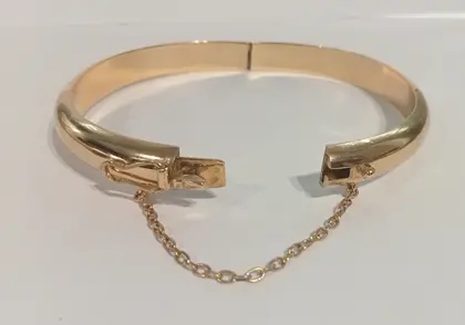 Pulsera media caña oro amarillo 18 kilates